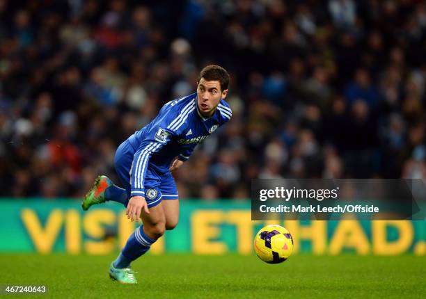 Eden Hazard of Chelsea manages to stay on his feet and control the ball during the Barclays Premier League match between Manchester City and Chelsea...
