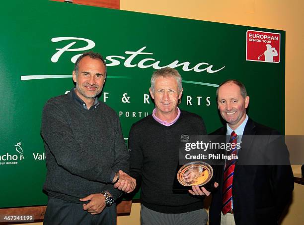 Andrew Murray of England is presented with the trophy by Andy Stubbs, Managing Director of the European Senior Tour and Jose Matias, Director of...