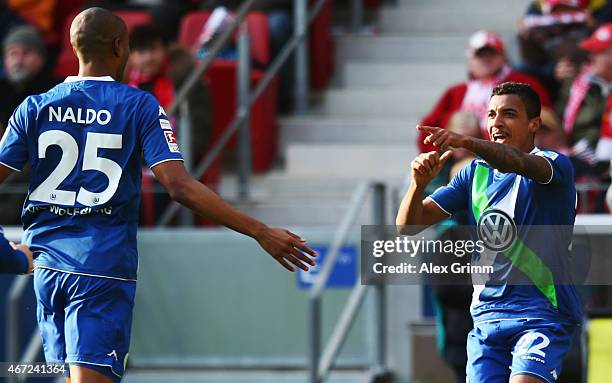 Luiz Gustavo of Wolfsburg celebrates his team's first goal with team mate Naldo during the Bundesliga match between 1. FSV Mainz 05 and VfL Wolfsburg...