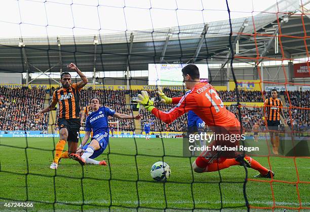 Ahmed Elmohamady of Hull City shoots past goalkeeper Thibaut Courtois of Chelsea to score their first goal during the Barclays Premier League match...