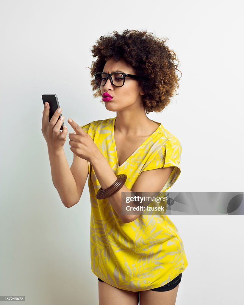 Afro American Young Woman using smart phone