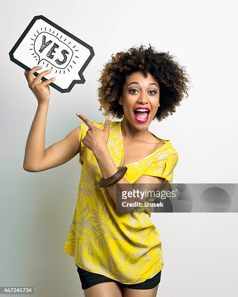excited afro american woman with speech bubble - yes stock pictures, royalty-free photos & images