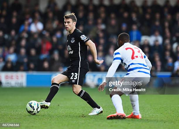 Seamus Coleman of Everton is closed down by David Hoilett of QPR during the Barclays Premier League match between Queens Park Rangers and Everton at...