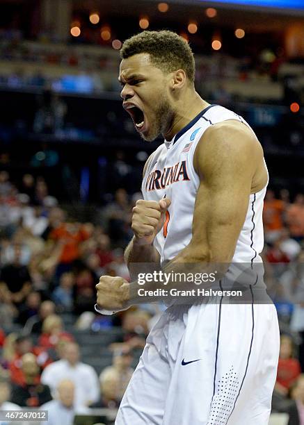 Justin Anderson of the Virginia Cavaliers reacts against the Michigan State Spartans during the third round of the 2015 NCAA Men's Basketball...