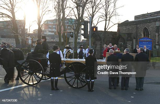 The coffin containing the remains of King Richard III is placed onto a carriage as it leaves St Nicholas Church during a procession through Leicester...