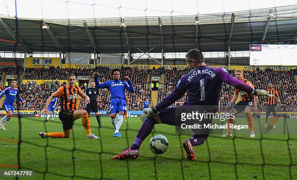 Loic Remy of Chelsea beats goalkeeper Allan McGregor of Hull City to score their third goal during the Barclays Premier League match between Hull...