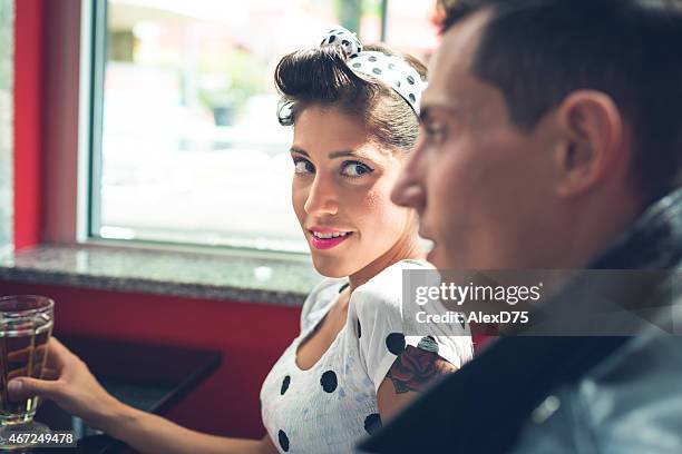 pinup girl looking at camera - 1950's style - teddy boys 1950s stock pictures, royalty-free photos & images