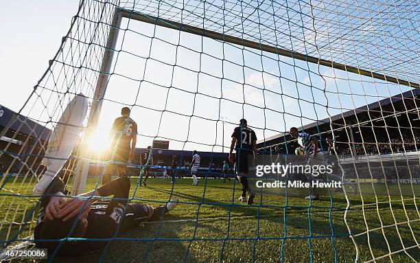 James McCarthy of Everton lies in the goal after the goal scored by Eduardo Vargas of QPR during the Barclays Premier League match between Queens...