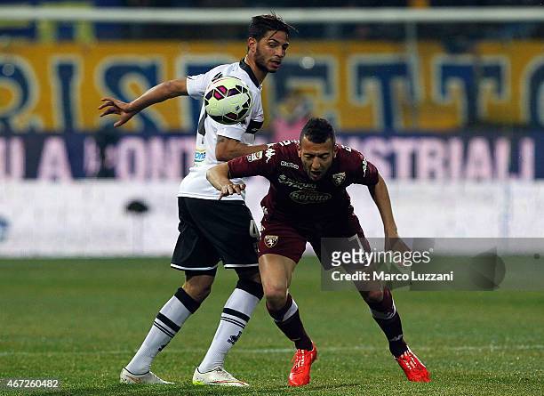Omar El Kaddouri of Torino FC is challenged by Pedro Mendes of Parma FC during the Serie A match between Parma FC and Torino FC at Stadio Ennio...