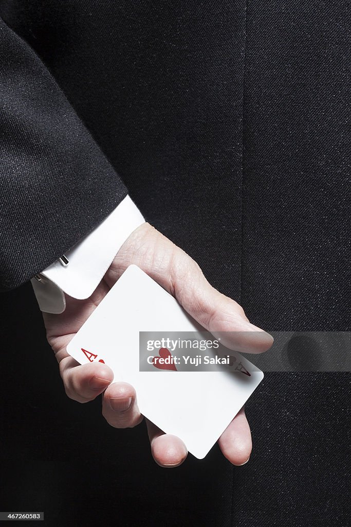 Wearing Tuxedo man holding Hart A