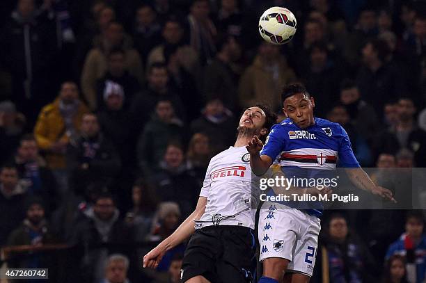 Luis Muriel of Sampdoria and Andrea Ranocchia of Internazionale Milano compete for a header during the Serie A match between UC Sampdoria and FC...