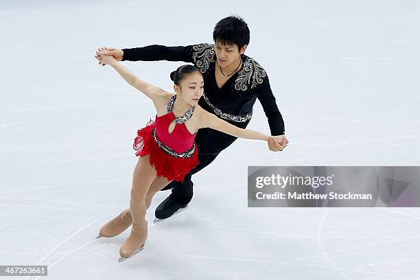 Narumi Takahashi and Ryuichi Kihara of Japan compete in the Figure Skating Pairs Short Program during the Sochi 2014 Winter Olympics at Iceberg...