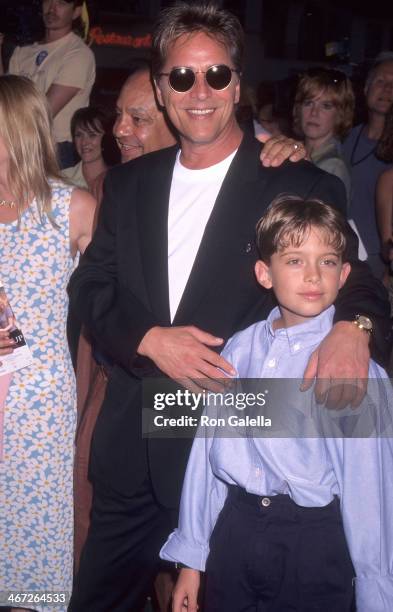 Actor Don Johnson and Melanie Griffith's son Alexander Bauer attend the "Tin Cup" Westwood Premiere on August 1, 1996 at the Mann Village Theatre in...
