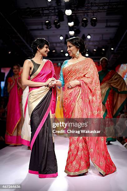 Shabana Azmi walks the runway with Mandira Bedi on day 5 of Lakme Fashion Week Summer/Resort 2015 at Palladium Hotel on March 22, 2015 in Mumbai,...