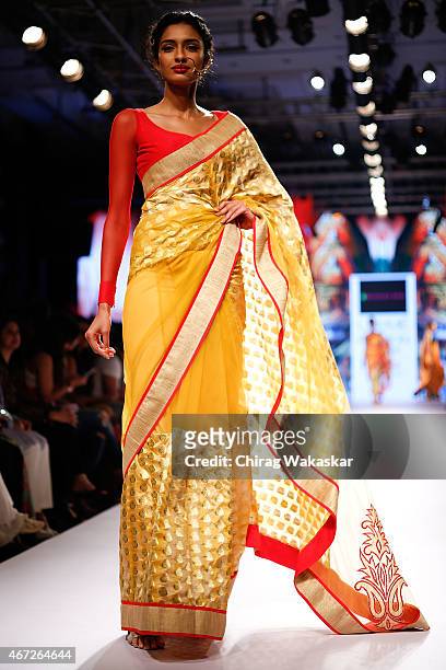 Model walks the runway during the Mandira Bedi show on day 5 of Lakme Fashion Week Summer/Resort 2015 at Palladium Hotel on March 22, 2015 in Mumbai,...