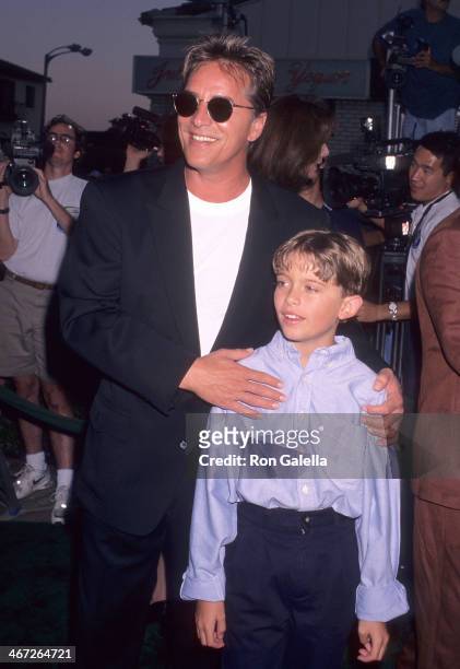 Actor Don Johnson and Melanie Griffith's son Alexander Bauer attend the "Tin Cup" Westwood Premiere on August 1, 1996 at the Mann Village Theatre in...