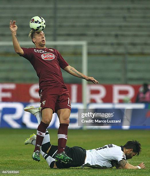 Maxi Lopez of Torino FC is challenged by Pedro Mendes of Parma FC during the Serie A match between Parma FC and Torino FC at Stadio Ennio Tardini on...