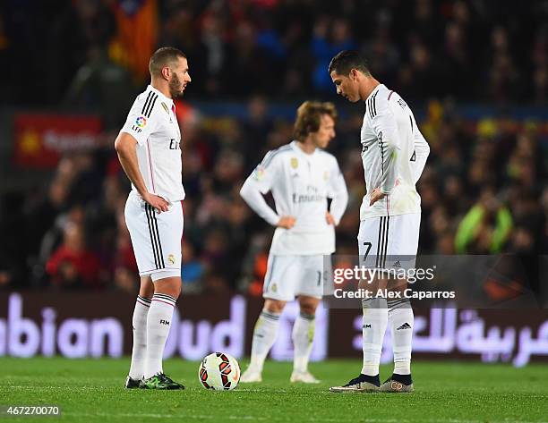 Karim Benzema, Luka Modric and Cristiano Ronaldo of Real Madrid CF look dejected as Luis Suarez of Barcelona scores their second goal during the La...