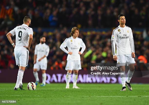 Karim Benzema, Luka Modric and Cristiano Ronaldo of Real Madrid CF look dejected as Luis Suarez of Barcelona scores their second goal during the La...