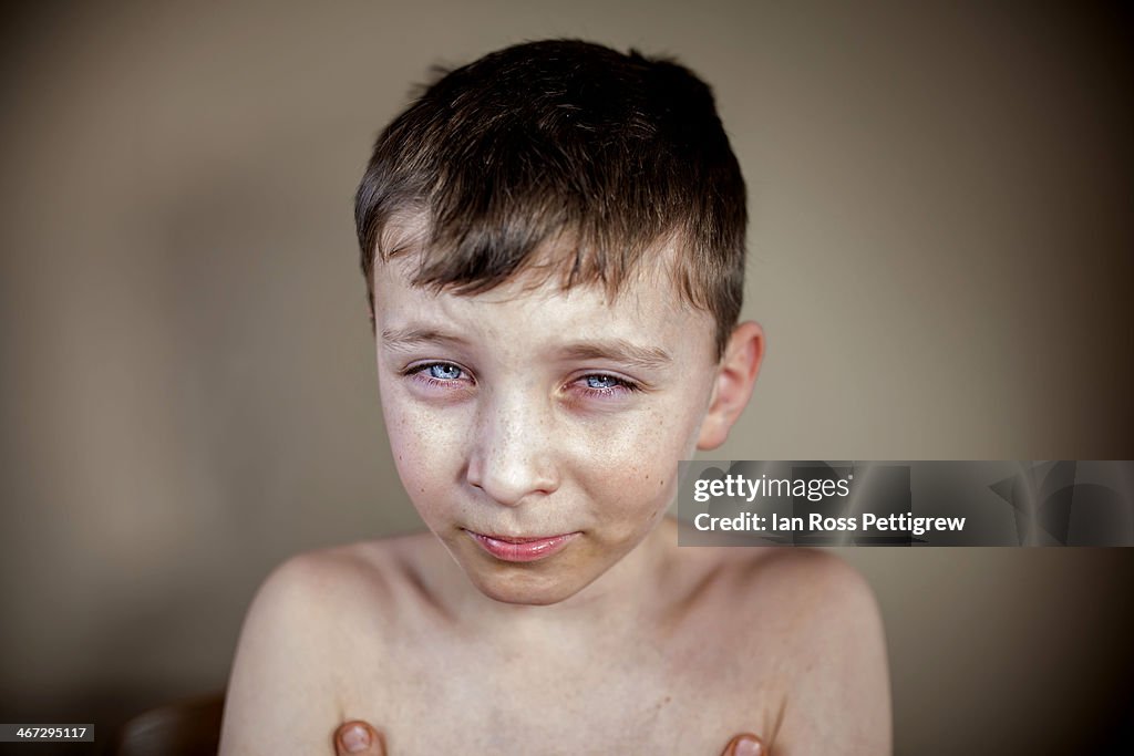 Young boy with teary eyes