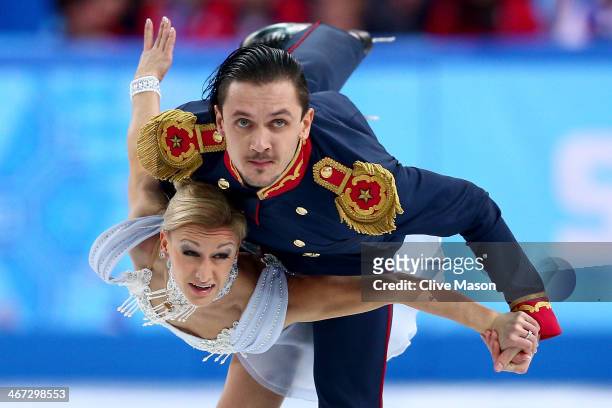 Tatiana Volosozhar and Maxim Trankov of Russia compete in the Figure Skating Pairs Short Program during the Sochi 2014 Winter Olympics at Iceberg...