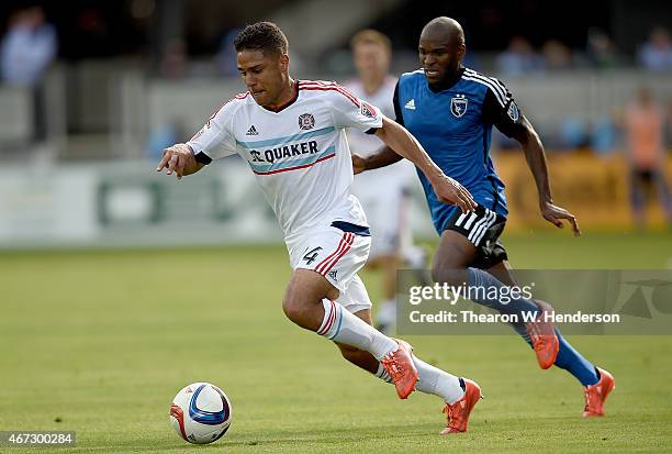 Quincy Amarikwa of the Chicago Fire moves the ball against Innocent Emeghara of San Jose Earthquakes during the first half at Avaya Stadium on March...