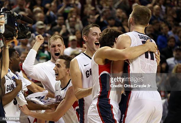 Domantas Sabonis of the Gonzaga Bulldogs celebrates with teammates Kyle Wiltjer and Kevin Pangos after defeating the Iowa Hawkeyes 87 to 68 during...