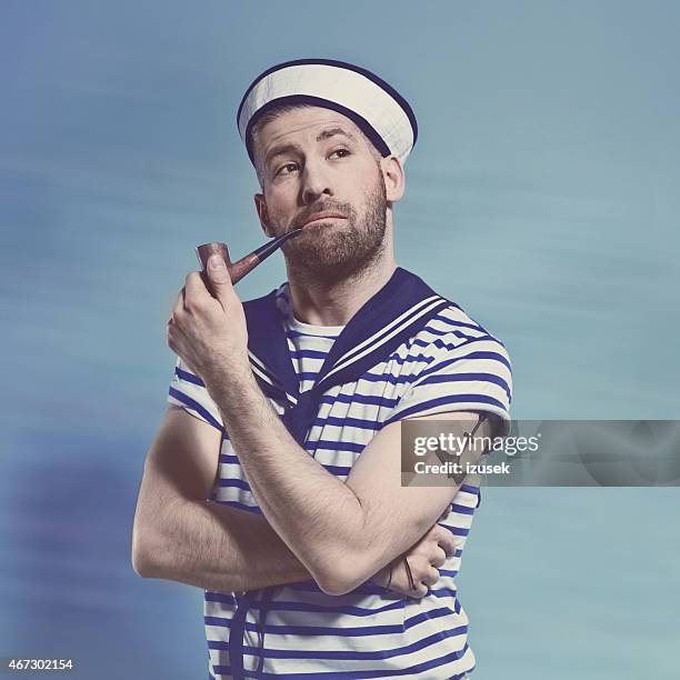 bearded sailor man smoking pipe - sailor suit stock pictures, royalty-free photos & images