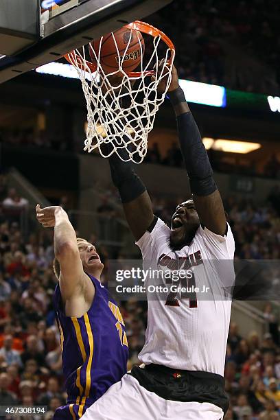 Montrezl Harrell of the Louisville Cardinals dunks the ball over Nate Buss of the Northern Iowa Panthers in the first half of the game during the...