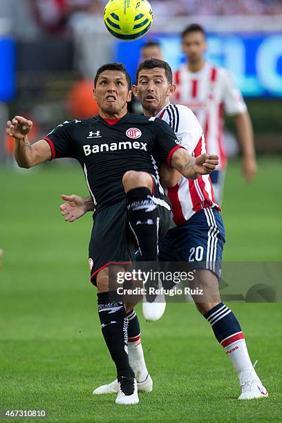 Israel Castro of Chivas fights for the ball with Francisco Gamboa of Toluca during a match between Chivas and Toluca as part of 11th round of...
