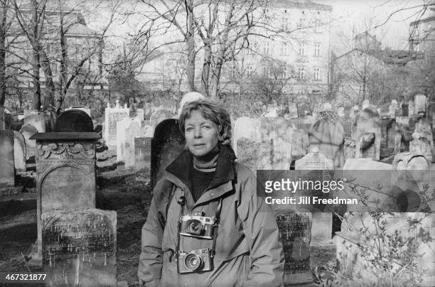 Photographer Jill Freedman in a Jewish cemetery in Poland, circa 1993.