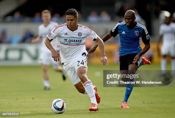 Quincy Amarikwa of Chicago Fire dribbles the ball towards the goal pursued by Innocent Emeghara of San Jose Earthquakes during the first half at...