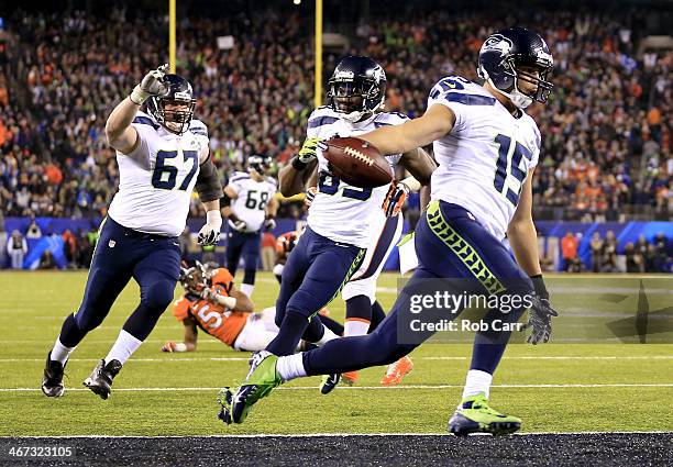 Wide receiver Jermaine Kearse of the Seattle Seahawks runs 23 yards to score a third quarter touchdown against the Denver Broncos during Super Bowl...