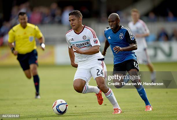 Quincy Amarikwa of Chicago Fire dribbles the ball towards the goal pursued by Innocent Emeghara of San Jose Earthquakes during the first half at...