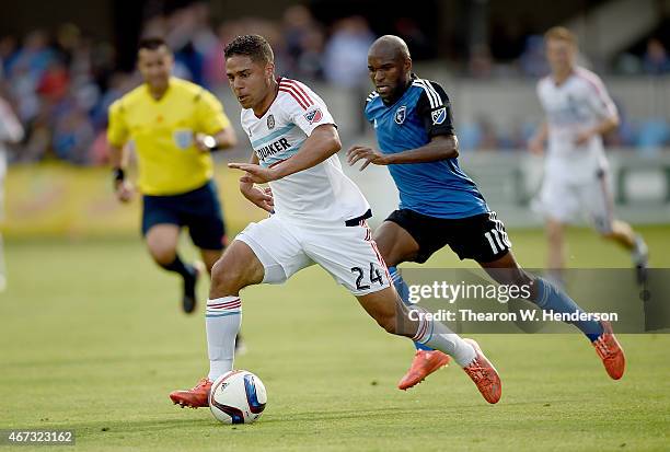 Quincy Amarikwa of Chicago Fire dribbles the ball towards the goal pursued by Innocent Emeghara of San Jose Earthquakes during the first half at...