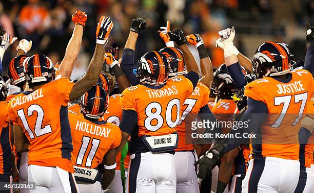 The Denver Broncos show camaraderie before playinga against the Seattle Seahawks during Super Bowl XLVIII at MetLife Stadium on February 2, 2014 in...