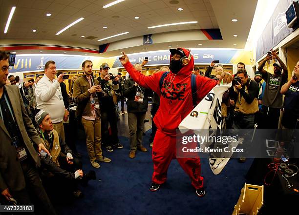 Running back Marshawn Lynch of the Seattle Seahawks celebrates in the locker room after their 43-8 victory over the Denver Broncos during Super Bowl...