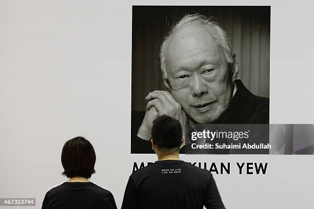 Couple pays tribute at Tanjong Pagar Community Club following the passing of former Prime Minister Lee Kuan Yew on March 23, 2015 in Singapore....