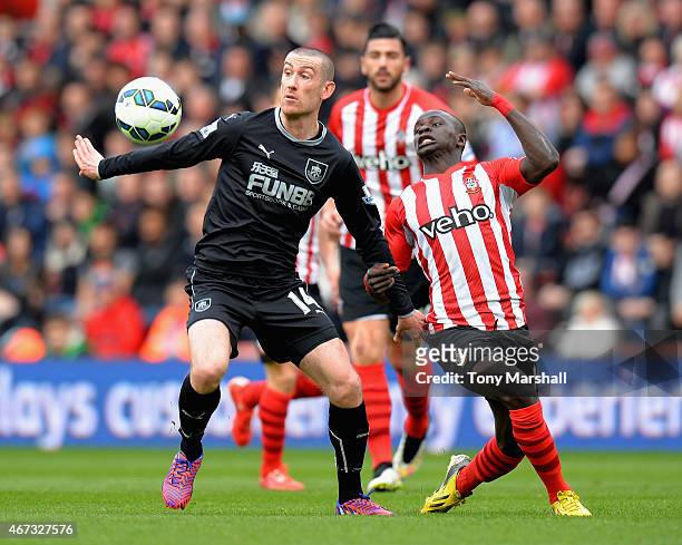 Sadio Mane of Southampton challenges David Jones of Burnley during the Barclays Premier League match between Southampton and Burnley at St Mary's...