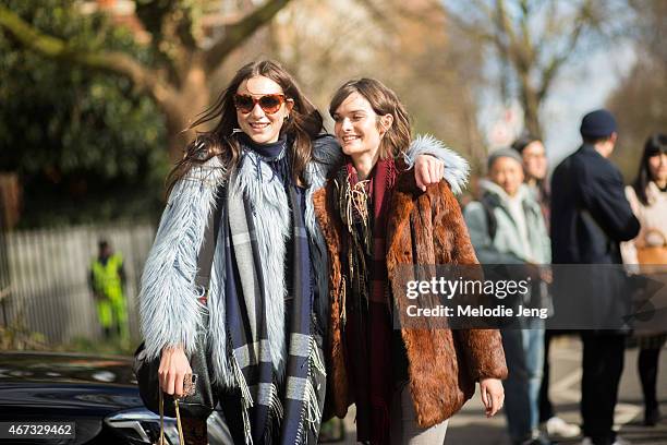 British models Matilda Lowther and Sam Rollinson exit the Burberry show in Burberry scarves during London Fashion Week Fall/Winter 2015/16 at...