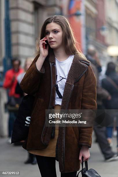 Model Xannie Carter exits the Emilio De La Morena show in an Acne coat and Calvin Klein t-shirt during London Fashion Week Fall/Winter 2015/16 at...