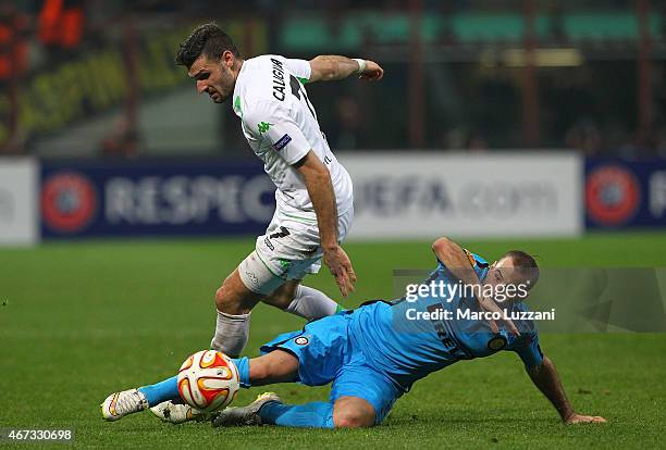 Daniel Caligiuri of VfL Wolfsburg competes for the ball with Rodrigo Palacio of FC Internazionale Milano during the UEFA Europa League Round of 16...