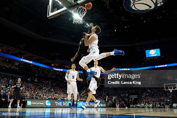 Grayson Allen of the Duke Blue Devils defends a shot by Angelo Chol of the San Diego State Aztecs during the third round of the 2015 NCAA Men's...