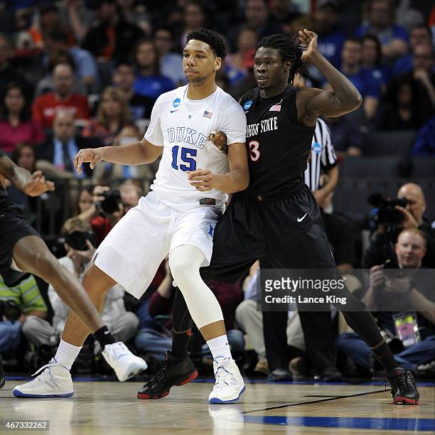 Angelo Chol of the San Diego State Aztecs defends Jahlil Okafor of the Duke Blue Devils during the third round of the 2015 NCAA Men's Basketball...