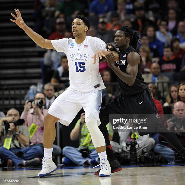 Angelo Chol of the San Diego State Aztecs defends Jahlil Okafor of the Duke Blue Devils during the third round of the 2015 NCAA Men's Basketball...