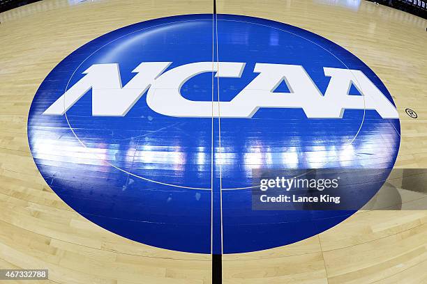 View of the NCAA logo at mid-court prior to a game between the Michigan State Spartans and the Virginia Cavaliers during the third round of the 2015...