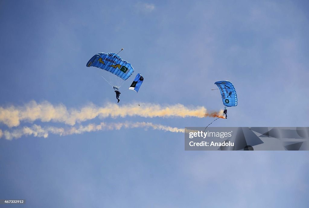 Pakistani soldiers parachute during National Day celebrations in Islamabad