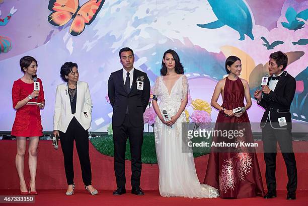Director of Murmur of the Hearts Sylvia Chang, and cast members Joseph Chang, Isabella Leong, Angelica Li Xin Jie and Lawrence Ko attend the Grand...