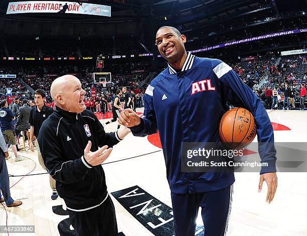 Al Horford of the Atlanta Hawks talks with referee Joey Crawford before the game against the San Antonio Spurs on March 22, 2015 at Philips Arena in...