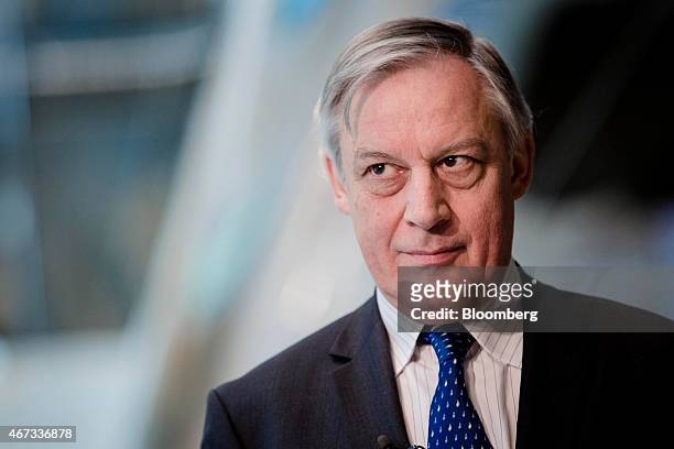 Christian Noyer, governor of the Bank of France, pauses during an interview at the Policies for the Post Crisis Era conference at the Banque De...